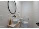 Stylish powder room featuring shiplap walls, a unique mirror, and modern fixtures at 3010 E Glenrosa Ave, Phoenix, AZ 85016