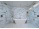 Luxurious bathroom featuring a soaking tub, rainfall shower, and elegant tile work at 3010 E Glenrosa Ave, Phoenix, AZ 85016