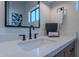 Bathroom sink with dark faucet and mirror features a clean, modern design and luxurious feel at 3010 E Glenrosa Ave, Phoenix, AZ 85016