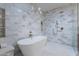 A freestanding tub next to a rainfall shower creates a spa-like bathroom at 3010 E Glenrosa Ave, Phoenix, AZ 85016