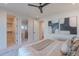 This primary bedroom shows the walk-in closet, bathroom, and modern artwork in the room at 3010 E Glenrosa Ave, Phoenix, AZ 85016