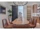 Dining space featuring a modern light fixture, decor and black sliding barn door at 3010 E Glenrosa Ave, Phoenix, AZ 85016