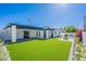 Aerial view of home featuring artificial turf, landscaping and covered patio at 3010 E Glenrosa Ave, Phoenix, AZ 85016