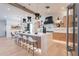 Spacious kitchen with an oversized island, sleek lighting, and modern wooden cabinets at 3010 E Glenrosa Ave, Phoenix, AZ 85016