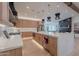 Bright, modern kitchen features light wood cabinetry, a large island, and stainless steel appliances at 3010 E Glenrosa Ave, Phoenix, AZ 85016