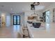 Open-concept living area featuring modern barstools, wood floors, and a stylish sink at 3010 E Glenrosa Ave, Phoenix, AZ 85016