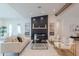 Bright living room with modern fireplace, light wood floors, and stylish furnishings at 3010 E Glenrosa Ave, Phoenix, AZ 85016