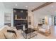 Cozy living room featuring a modern fireplace with a wooden beam mantle at 3010 E Glenrosa Ave, Phoenix, AZ 85016