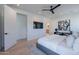 Bright main bedroom with a television, artwork, and a view of the backyard at 3010 E Glenrosa Ave, Phoenix, AZ 85016