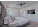 Relaxing main bedroom with a ceiling fan, television, and a view of the backyard at 3010 E Glenrosa Ave, Phoenix, AZ 85016