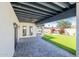 Covered patio with pavers, artificial turf, and lush landscaping at 3010 E Glenrosa Ave, Phoenix, AZ 85016