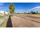 Scenic backyard on golf course with lush green grass and blue skies at 7061 E Broadway Rd # 48, Mesa, AZ 85208