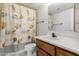 Bathroom features a seashell themed shower curtain and single sink vanity at 7061 E Broadway Rd # 48, Mesa, AZ 85208