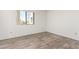 Bedroom featuring wood-look floors, ample natural light, and neutral walls at 7061 E Broadway Rd # 48, Mesa, AZ 85208