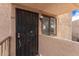 Charming condo entrance featuring secure door and a cozy, well-lit entryway at 7061 E Broadway Rd # 48, Mesa, AZ 85208