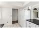 Bright kitchen features white cabinetry, tiled floors, and modern refrigerator at 7061 E Broadway Rd # 48, Mesa, AZ 85208