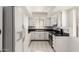 Well-lit kitchen featuring white cabinets and sleek countertops at 7061 E Broadway Rd # 48, Mesa, AZ 85208