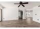 Spacious living room showcasing hardwood floors, a view to the kitchen, and ample natural light at 7061 E Broadway Rd # 48, Mesa, AZ 85208