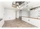 Open living room with hardwood floors and a mirrored ceiling at 7061 E Broadway Rd # 48, Mesa, AZ 85208