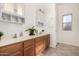 Well-lit bathroom features dual sinks, ample cabinet space, and a modern design at 8757 W El Caminito Dr, Peoria, AZ 85345