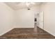 Cozy bedroom with hardwood floor, ceiling fan, and plenty of natural light at 8757 W El Caminito Dr, Peoria, AZ 85345