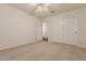 Neutral bedroom with carpet and walk in closet at 8757 W El Caminito Dr, Peoria, AZ 85345
