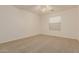 Neutral bedroom with carpet, ceiling fan, and plenty of natural light at 8757 W El Caminito Dr, Peoria, AZ 85345