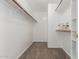 Spacious walk-in closet with built-in shelves and rods, providing ample storage at 8757 W El Caminito Dr, Peoria, AZ 85345