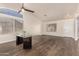 Open dining area boasting modern table, sleek floors, high ceilings, and ample natural light at 8757 W El Caminito Dr, Peoria, AZ 85345