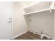 Functional laundry room with shelving, providing ample storage and convenience at 8757 W El Caminito Dr, Peoria, AZ 85345