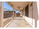 Covered patio overlooking the fenced pool area, perfect for outdoor entertaining and relaxation at 8757 W El Caminito Dr, Peoria, AZ 85345