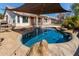 Inviting pool area with shade, perfect for relaxing and entertaining outdoors in a well-maintained backyard at 8757 W El Caminito Dr, Peoria, AZ 85345
