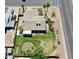 This overhead shot highlights a home's layout, lush backyard, and proximity to neighborhood streets at 9719 N 45Th Ave, Glendale, AZ 85302