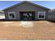 View of home's backyard featuring a covered patio and sliding glass doors at 11422 E Utah Ave, Mesa, AZ 85212