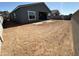 Spacious backyard ready for customization with a block fence and a view of neighboring homes at 11422 E Utah Ave, Mesa, AZ 85212