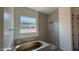 New bathroom with a soaking tub and tiled shower at 11422 E Utah Ave, Mesa, AZ 85212