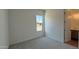 Well-lit bedroom with neutral carpet and window view at 11422 E Utah Ave, Mesa, AZ 85212