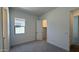 Comfortable carpeted bedroom with a window and closet at 11422 E Utah Ave, Mesa, AZ 85212