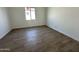 Bright and airy bedroom featuring neutral walls and tile flooring, perfect for relaxation at 11422 E Utah Ave, Mesa, AZ 85212