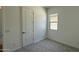 Bedroom featuring neutral carpet, natural light and an adjoining bathroom at 11422 E Utah Ave, Mesa, AZ 85212