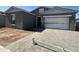 Charming single-story home with a paved driveway and an attached two-car garage at 11422 E Utah Ave, Mesa, AZ 85212