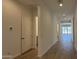 Bright hallway with wood-look flooring leading to the home's living spaces at 11422 E Utah Ave, Mesa, AZ 85212