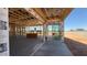 Construction of an indoor/outdoor living space, features exposed wooden framework and sliding glass doors at 11422 E Utah Ave, Mesa, AZ 85212