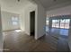 Open-concept living space with tile floors and large sliding doors opening to the backyard at 11422 E Utah Ave, Mesa, AZ 85212