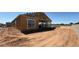 Image of a new construction home showcasing the initial framing and construction progress at 11422 E Utah Ave, Mesa, AZ 85212