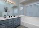 Bright bathroom with double sinks, bath tub, and ample counter space at 1282 W Kesler Ln, Chandler, AZ 85224