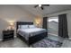 Serene bedroom with a dark wood bed frame, plush bedding, and neutral decor, creating a relaxing atmosphere at 1282 W Kesler Ln, Chandler, AZ 85224