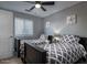 Inviting bedroom featuring two twin beds and a ceiling fan at 1282 W Kesler Ln, Chandler, AZ 85224