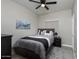 Cozy bedroom with ceiling fan, stylish decor and a comfortable bed at 1282 W Kesler Ln, Chandler, AZ 85224