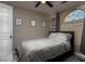 Comfortable bedroom featuring a ceiling fan, large window, and tasteful decor at 1282 W Kesler Ln, Chandler, AZ 85224